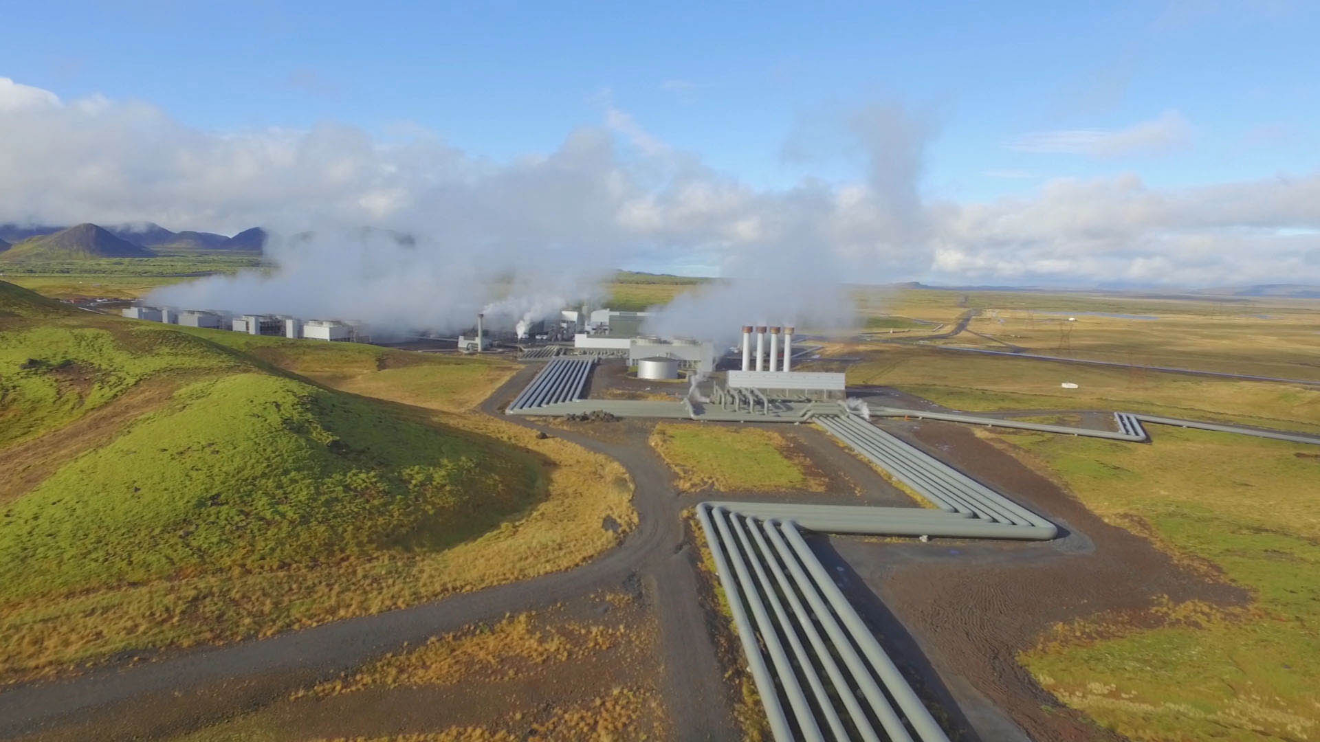 Steam generated by volcanic heat two kilometres beneath the ground welcomes visitors at Hellisheidi, one of the largest geothermal power plants in the world