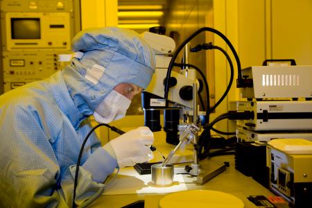 Microtechnologist in the Cleanroom - A microtechnologist mounting laser stacks – such diode lasers deliver specifically high output powers as, for example, required for materials processing.
