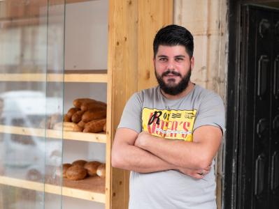 This bakery has been in the same spot since 1955. It was opened by his grandfather who handed it over to his father, and now it is proudly run by Islam Suhail Abu Ajaj. It’s a thriving business in the heart of a very vibrant commercial centre. With a solid reputation for offering excellent service and a wonderful range of bread products, Islam Suhail Abu Ajaj decided that he wanted to increase his offering. With a small loan from Vitas, he was able to buy a new machine that allows him to make a baguette type roll which he can sell directly to the public, but more importantly he is now selling this product to hotels and cafes who offer sandwich products to their clients. The increase in turnover from one machine has allowed him to take on at least one new member of staff, he’s increased productivity because he’s not making the same product by hand anymore, and he’s planning to continue to expand the business and offer new and interesting bread products. Vitas to him is necessary for the continued development of small and medium sized businesses in the west bank who wouldn’t have access to any financial products to help grow their businesses. This source of micro capital is vital to development in the West Bank.
