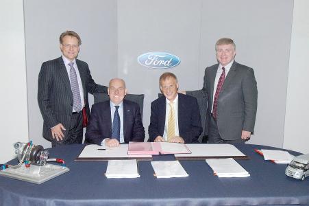 Signing with Ford research cntre head, Ford Chairman, EIB Vice-president Simon Brooks and Minister of State for Business and Enterprise Marc Prisk