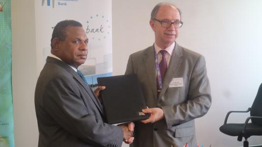 Signing ceremony: Minister Patrick Pruaitch and Patrick Walsh, Deputy-Director General of the European Investment Bank responsible for lending outside Europe.