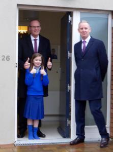 Simon Coveney and Andrew McDowell celebrate the signing of the Housing Finance Agency’s contract with Katie Ann Henly, nine