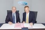 EIB Vice-president Simon Brooks signing GBP 450m loan with Ford Britaibn Chairman Joe Greenwell